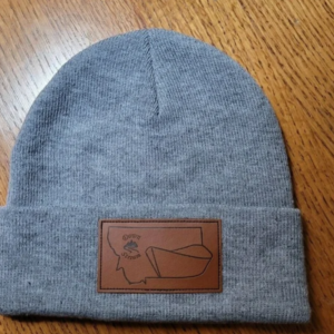 Downstream Boatworks gray beanie hat with a custom debossed leather logo patch on the front cuff.