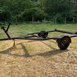 Downstream Boatworks custom drift boat trailer with adjustable carpeted marine bunks and a heavy duty steel winch post.