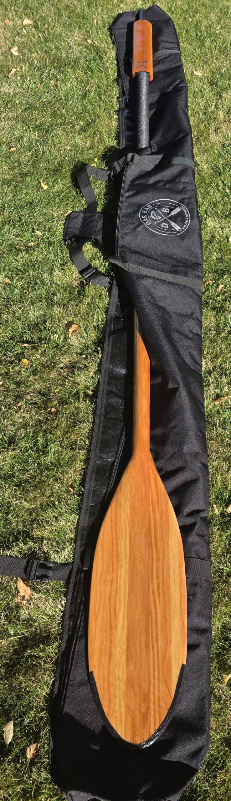 Premium custom wood oars paired with a heavy-duty travel oar bag handcrafted by Downstream Boatworks in Missoula Montana.
