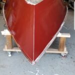 Custom composite drift boat hull construction layup in workshop by Downstream Boatworks in Missoula, Montana.